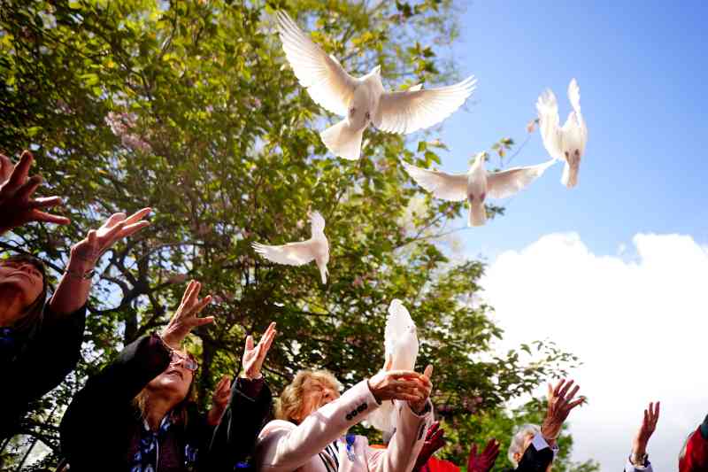 White doves are released during a memorial service outside the former Libyan embassy in St James’s Square, London