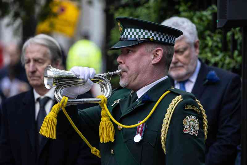 A bugler with the ambulance service sounds the Last Post
